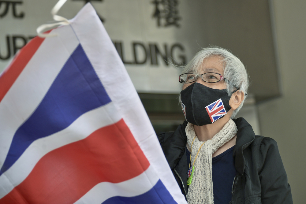 “Grandma Wong” waves the British flag outside a court building on March 25, 2021. File photo. “Grandma Wong” waves the British flag outside a court building on March 25, 2021. File photo.