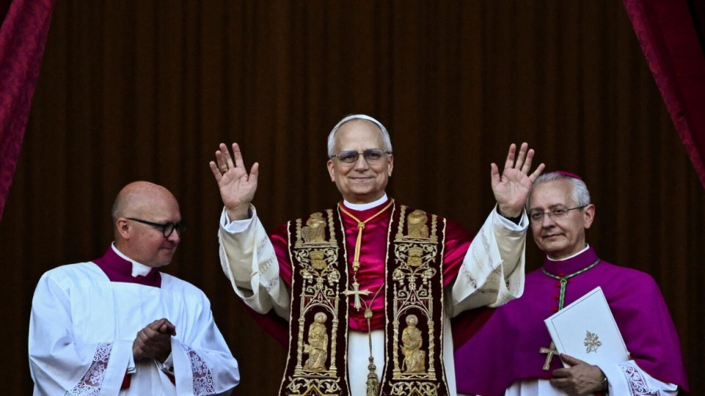 Newly elected Pope Leo XIV, Cardinal Robert F. Prevost of the USA, appears on the balcony of St. Peter's Basilica at the Vatican, May 8, 2025. © Dylan Martinez, Reuters