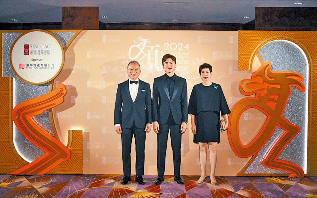 Secretary for Constitutional and Mainland Affairs Erick Tsang and his wife Louise Ho with Karson Choi.