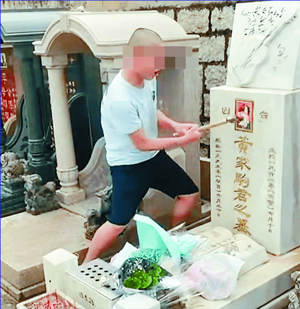 Screengrabs show Wong Ka-kui's gravestone being vandalized as a fan from the mainland weeps on her first visit to pray for her idol, who died in 1993.SING TAO