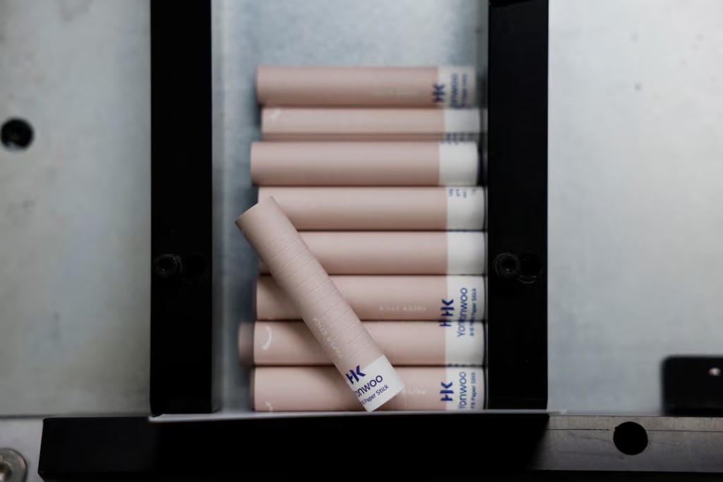 Produced peelable paper tubes for a solid perfume made from mineral paper at cosmetic packaging factory Yonwoo in Incheon, South Korea, April 7, 2026. REUTERS/Kim Soo-hyeon