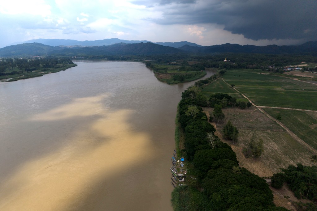 Photo by LILLIAN SUWANRUMPHA / AFP This aerial photo taken on June 4, 2026 shows fishing boats docked along the Mekong River in Chiang Saen, northern Thailand’s Chiang Rai province.