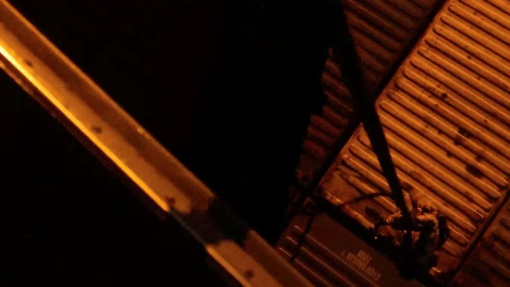 A U.S. Marine from the amphibious assault ship USS Tripoli rappels onto the Iranian-flagged cargo ship M/V Touska, in what the U.S. Central Command (CENTCOM) says is an operation to board and seize the cargo ship, in this screen grab taken from a handout video released on April 20, 2026. U.S. Central Command via X/Handout via REUTERS