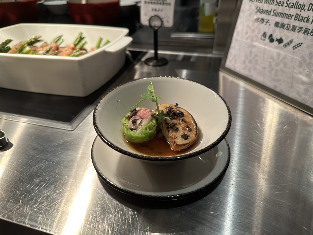 Poached Duck Foie Gras in Porcini and Burdock Broth.