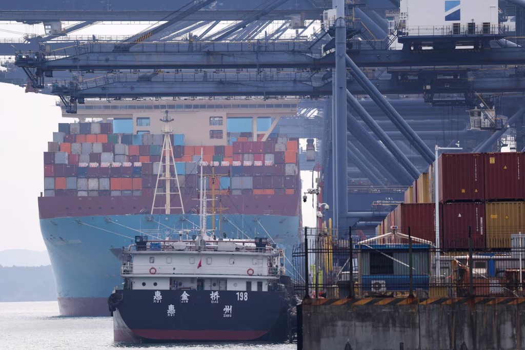 FILE PHOTO: A cargo ship with containers docks at a terminal of the Yantian port in Shenzhen, Guangdong province, China October 30, 2025. REUTERS