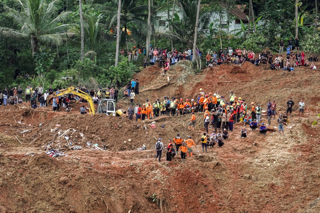 Indonesian rescue members search for victims at the site of a landslide, which hit Cibeunying village on November 13, in Cilacap, Central Java province, Indonesia, November 15, 2025. (Reuters)