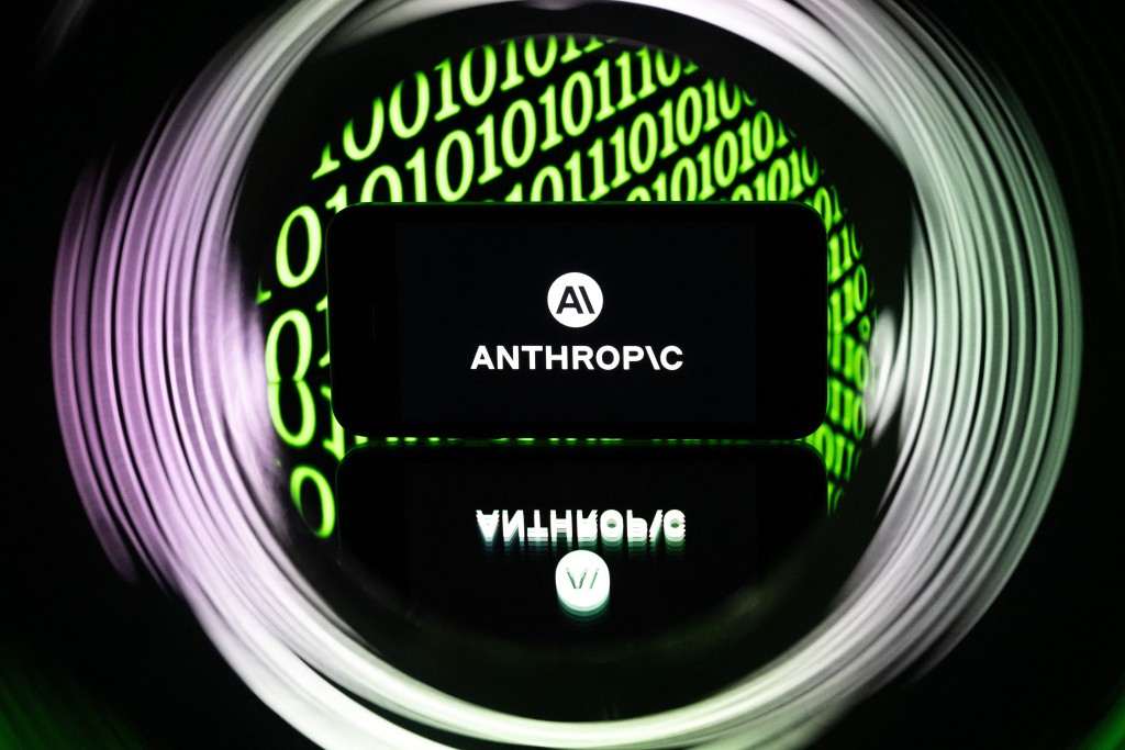 Photo by SEBASTIEN BOZON / AFP  This photograph shows a smartphone displaying the logo of the US artificial intelligence safety and research company Anthropic, in Mulhouse on April 21, 2026.