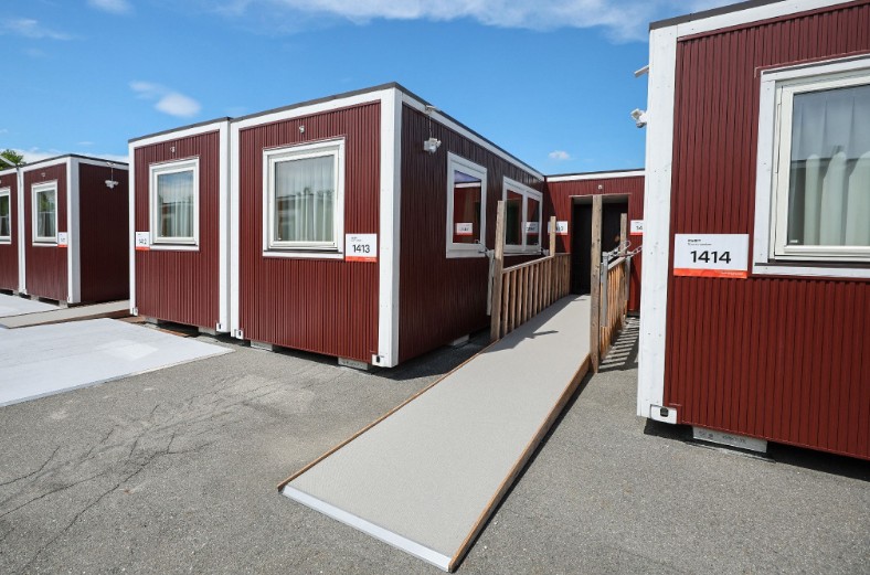 Nagoya's container-style huts are similar to the cabins used at the Milan-Cortina Winter Games, says Kirsty Coventry.r]