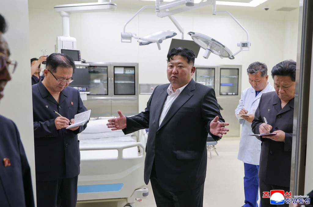 This June 24, 2026 picture released by North Korea's official Korean Central News Agency (KCNA) on June 26, 2026, shows North Korean leader Kim Jong Un (C) inspecting a newly constructed emergency medical facility in the Kalma Tourist Station in the Wonsan-Kalma Coastal Tourist Zone in Kangwon Province. (Photo by KCNA / KCNA VIA KNS / AFP) 