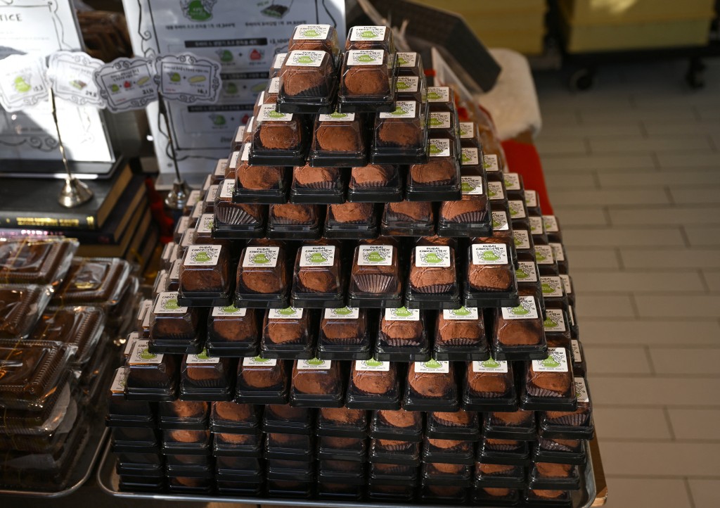 Photo by JUNG YEON-JE / AFP  "Dubai-style" chewy chocolate cookies are displayed at a bakery cafe in Seoul on January 20, 2026.