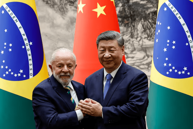 Chinese President Xi Jinping shakes hands with Brazil's President Luiz Inacio Lula da Silva after a signing ceremony and a joint press conference, at the Great Hall of the People in Beijing, China, May 13, 2025. REUTERS