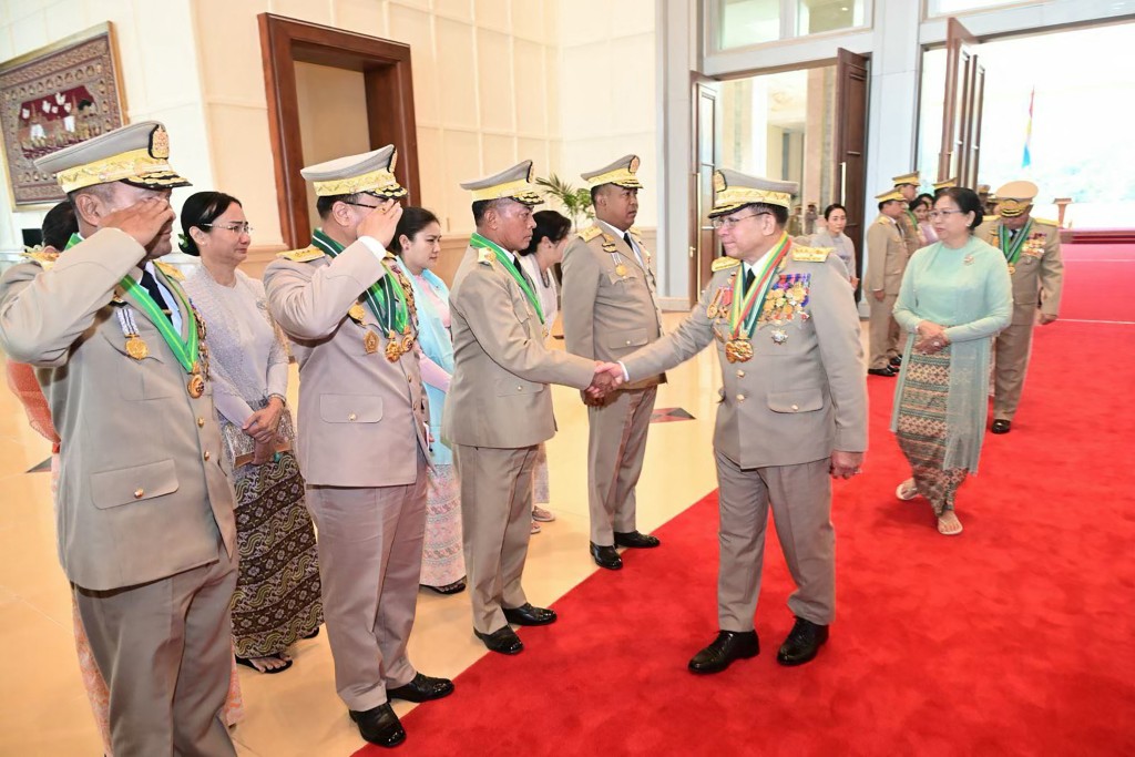 This handout picture taken and released on March 30, 2026 by the Myanmar Military Information Team shows Myanmar's outgoing military chief Min Aung Hlaing (centre R) arriving for a handover ceremony in Naypyidaw. (Photo by Handout / MYANMAR MILITARY INFORMATION TEAM / AFP)