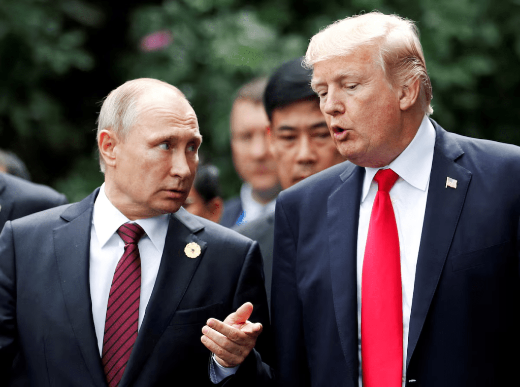 FILE PHOTO: U.S. President Donald Trump and Russia's President Vladimir Putin talk during the family photo session at the APEC Summit in Danang, Vietnam November 11, 2017. REUTERS/Jorge Silva/File Photo/File Photo
