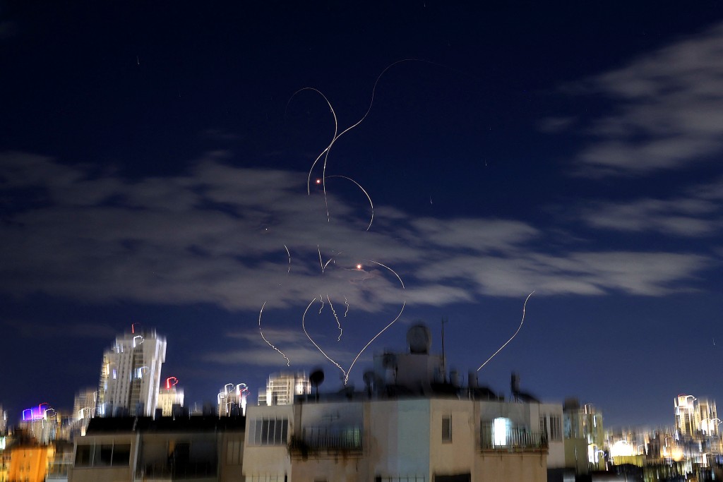 Rocket trails are seen in the sky above the Israeli center coastal city of Netanya amid a fresh barrage of Iranian missile attacks on March 9, 2026. (AFP)