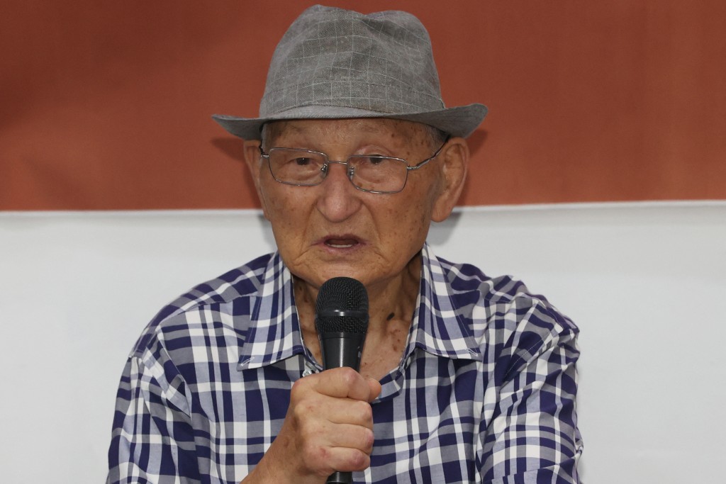 This picture taken on August 13, 2025 shows Ahn Hak-sop, a former prisoner of conscience convicted of spying for North Korea, speaking during a press conference in Seoul. Six elderly former North Korean spies have asked Seoul to repatriate them to the North, officials confirmed to AFP on August 19, after serving decades in prison while refusing to renounce their communist beliefs. (Photo by YONHAP / AFP)