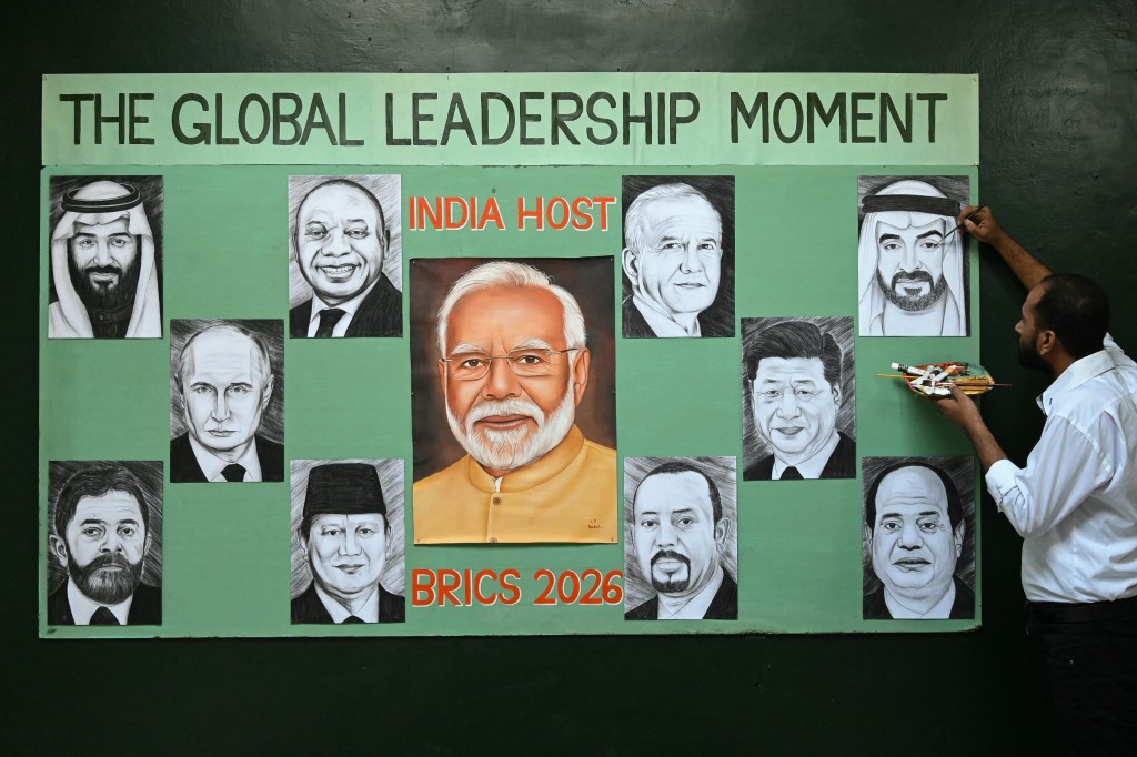 An artist gives final touches to paintings of BRICS member countries' leaders in Amritsar on September 10, 2026 ahead of the BRICS Summit on September 12 and 13 in New Delhi. (Photo by Narinder NANU / AFP)