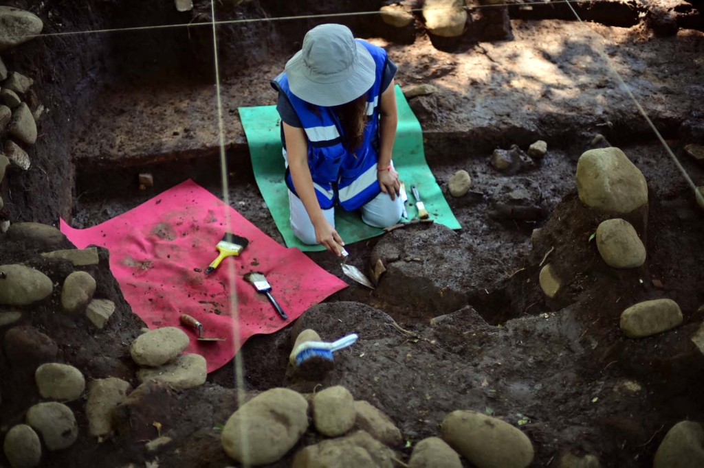 Photo by MARCO ANTONIO MARTINEZ / AFP Mexican archaeologist Mireya Moreno extracts artifacts at an archaeological site in Coatepec, Veracruz, Mexico, on June 18, 2026.