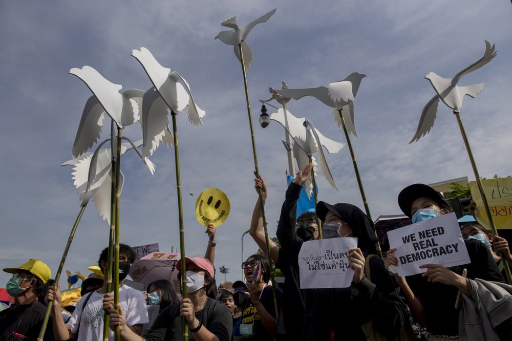 A pro-democracy protester holds up a poster during a rally in Bangkok, Thailand, Sunday.