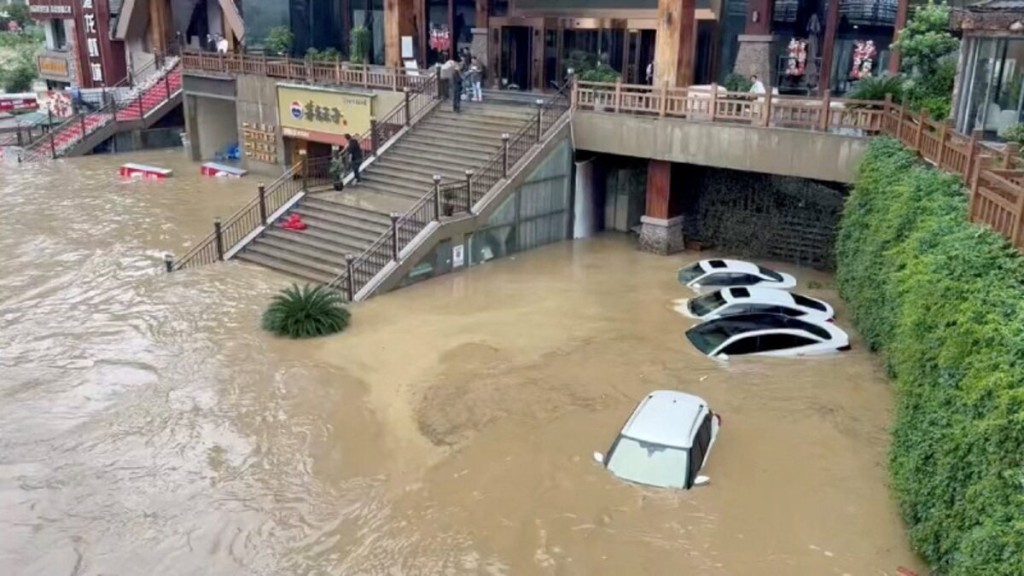 Cars lie partially submerged in floodwaters after heavy rainfall in Duyun, Guizhou Province, China, May 19, 2026, in this still image obtained from a social media video. Social Media/via REUTERS
