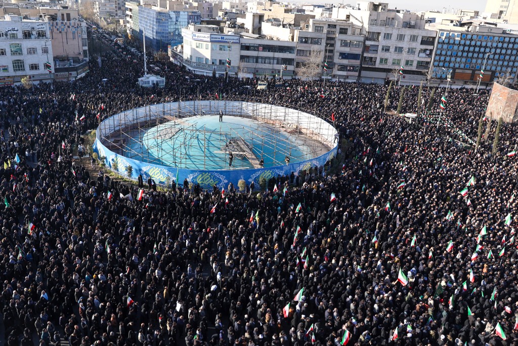 People gather to mourn the death of Iran’s supreme leader Ayatollah Ali Khamenei, who was killed in joint US and Israeli strikes, at a square in Tehran on March 1, 2026. (AFP)