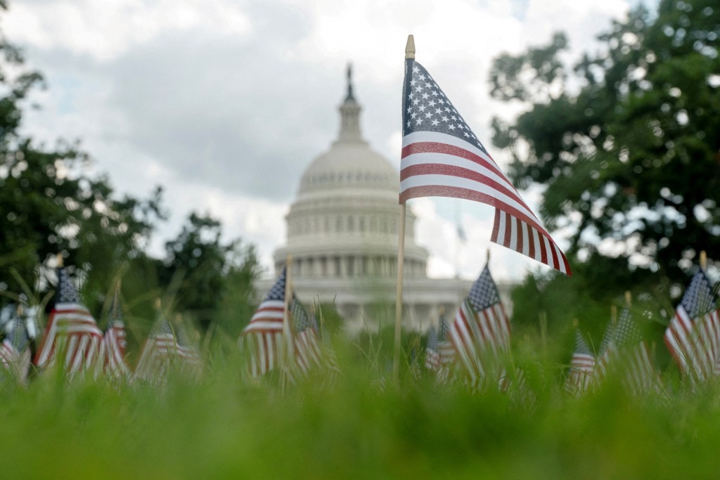 A single flag is planted in memory of Charlie Kirk, according of organizers at the Young America's Foundation, alongside a field of flags marking the anniversary of the 9/11 terrorist attacks outside of US Capitol after Charlie Kirk was shot dead in Utah, in Washington, D.C., September 11. REUTERS/Nathan Howard