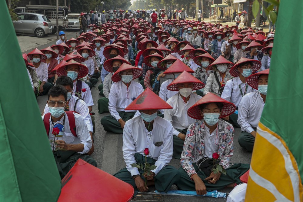 Anti-coup school teachers in their uniform and traditional Myanmar-hats participate in a demonstration in Mandalay, Myanmar, Wednesday, March 3, 2021