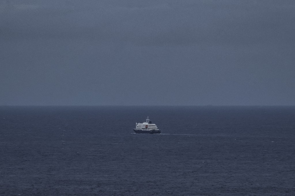 Photo by - / AFP  This general view shows the cruise ship MV Hondius, leaving the port of Praia, the capital of Cape Verde, on May 6, 2026.