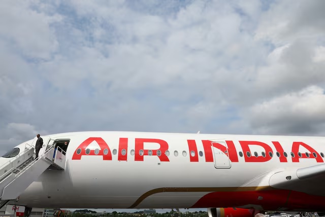 Branding for Air India is seen on an Airbus A350-900 at the Farnborough International Airshow, in Farnborough, Britain, July 24, 2024. REUTERS/Toby Melville/File Photo