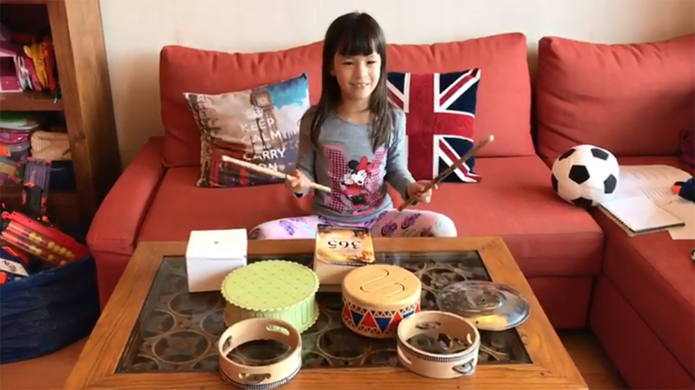 A Primary Year 2 student enjoys producing a series of rhymed percussion with various inverted vessels. A Primary Year 2 student enjoys producing a series of rhymed percussion with various inverted vessels.