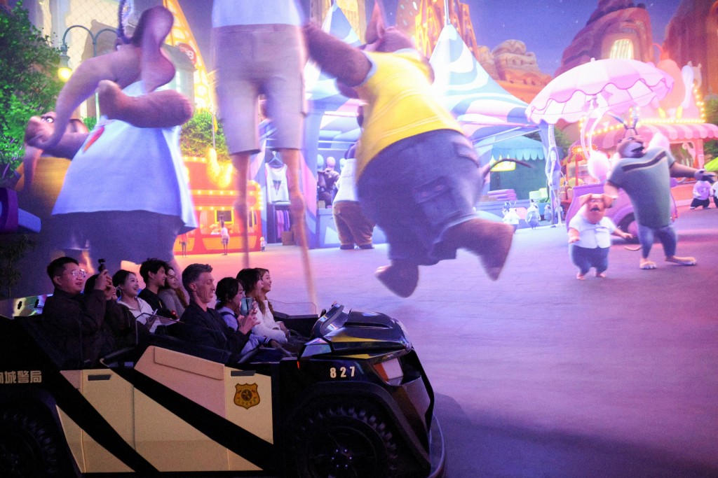 Park visitors enjoy an attraction at Zootopia Land in Shanghai Disneyland ahead of the release of the movie Zootopia 2, in Shanghai, China, November 24. (Reuters)
