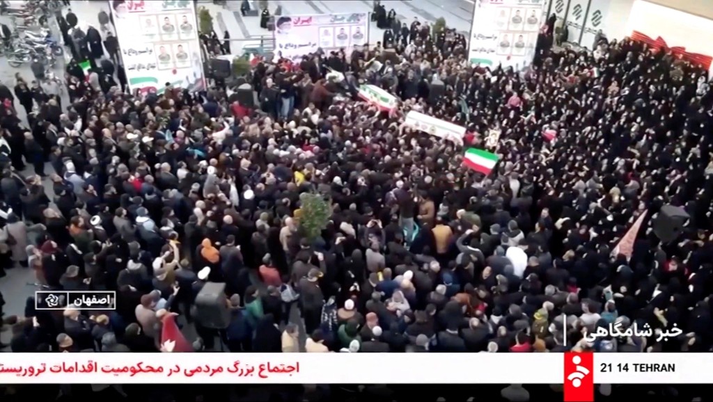 Mourners carry coffins during a funeral procession for members of security forces and civilians said to be killed in protests on Sunday, amid evolving anti-government unrest, in Tehran, Iran, in this screengrab from a video released on January 11, 2026. (Reuters)