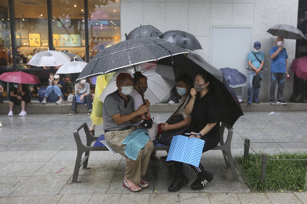 Protesters take cover in the rain during a rally against the government in Seoul, South Korea, Saturday. Thousands of anti-government protesters, marched through the soggy streets of South Korea's capital Saturday. Protesters take cover in the rain during a rally against the government in Seoul, South Korea, Saturday. Thousands of anti-government protesters, marched through the soggy streets of South Korea's capital Saturday.