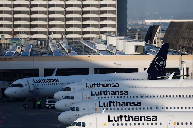 Aircraft of German air carrier Lufthansa are parked on the tarmac at the airport, as the company's pilots go on a two-day strike in a dispute over pensions, in Frankfurt, Germany, March 12, 2026. REUTERS/Heiko Becker