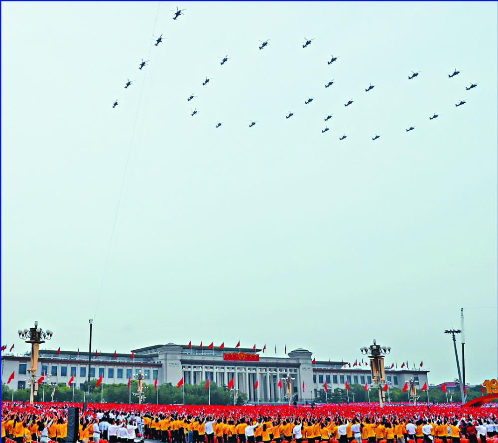 Attack helicopters form the numeral '100,' fighter jets do the same for '71,' and stealth fighters add color to the party celebrations. REUTERS, XINHUA, AFP