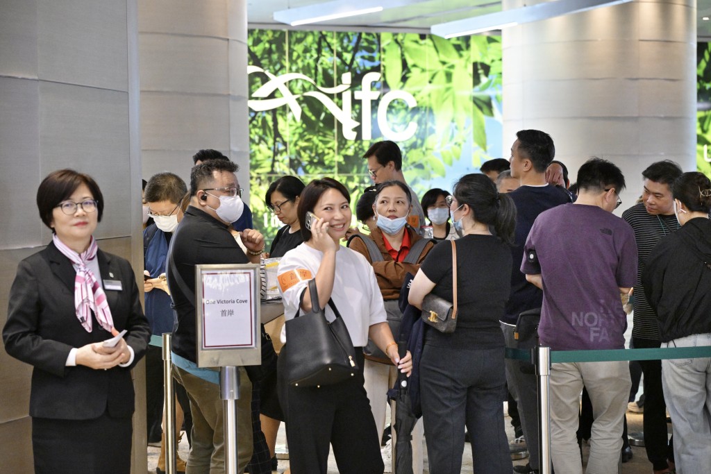 People line up to buy during the third round of sales.