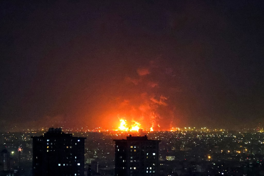Explosions erupt following strikes at Tehran Oil Refinery in Tehran on March 7, 2026. (AFP)