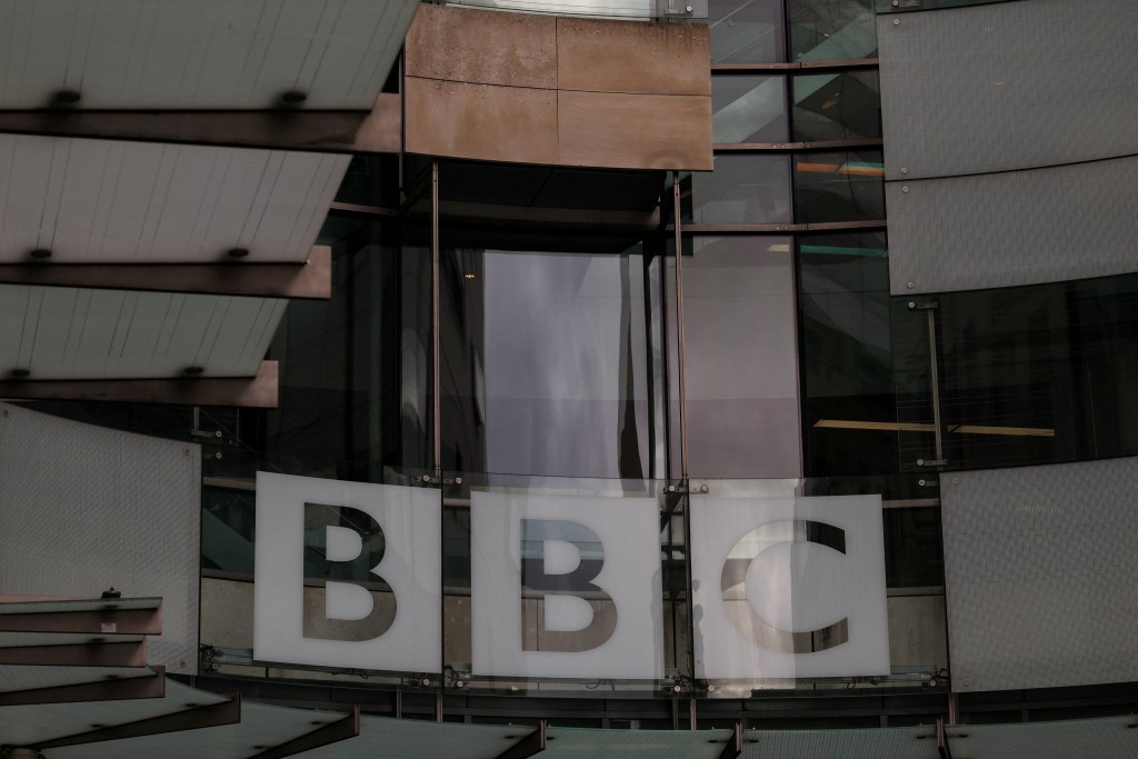 Photo by ADRIAN DENNIS / AFP  The logo of British broadcaster BBC is pictured at the entrance to their offices in London on November 11, 2025.