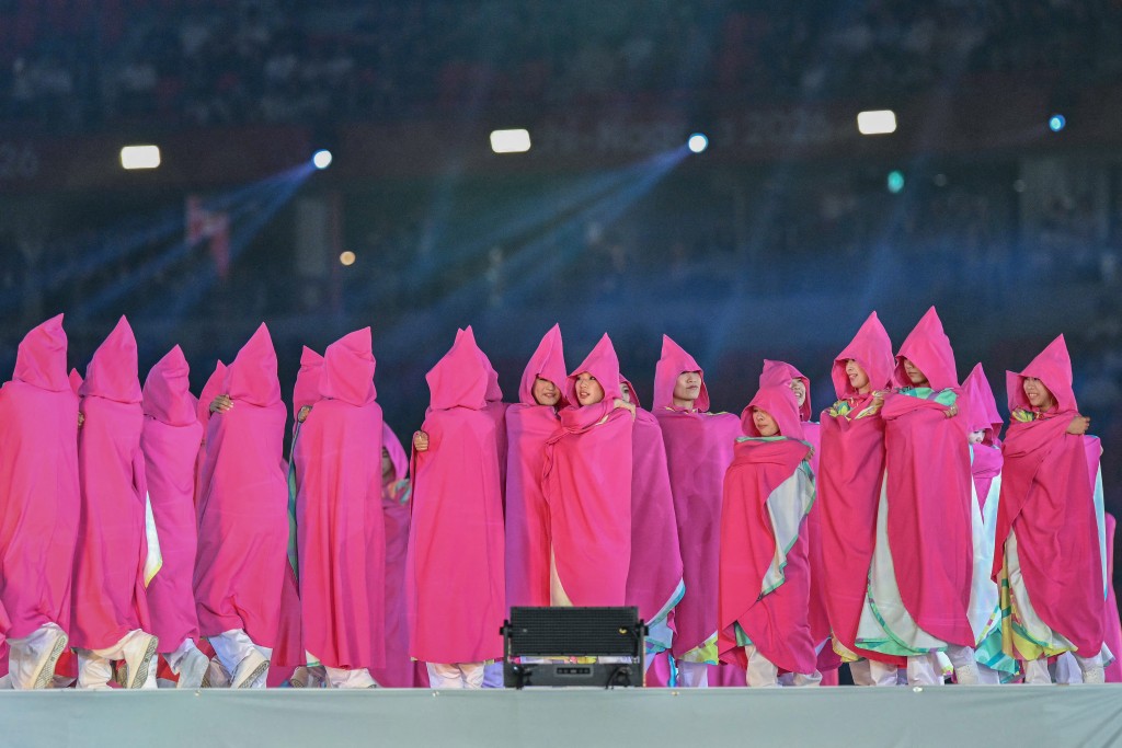 Artists perform during the opening ceremony of the 2026 Asian Games at Paloma Mizuho Stadium in Nagoya on September 19, 2026. (Photo by MOHD RASFAN / AFP)