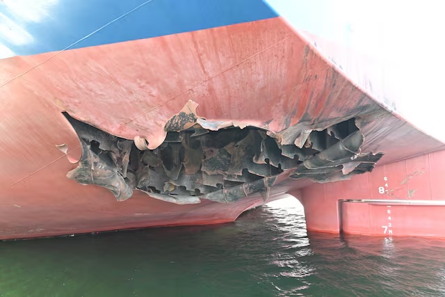 The damaged stern of a bulk carrier operated by South Korean shipper HMM, after it was struck by two unidentified objects on May 4 while stranded in the Strait of Hormuz, in this handout picture released on May 10, 2026. South Korean Foreign Ministry/Handout via REUTERS/File Photo