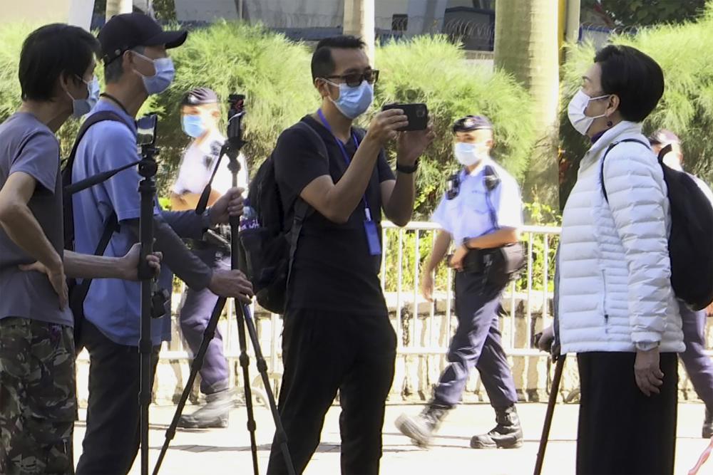 In this photo taken from video, Garry Pang Moon-yuen is seen outside the West Kowloon Court on Nov. 29, 2021. Pang and another Hong Konger were found guilty on a sedition charge on Thursday, Oct. 27, 2022, after they clapped and criticized the judge during a previous trial over a banned Tiananmen Square vigil in the city. (AP) In this photo taken from video, Garry Pang Moon-yuen is seen outside the West Kowloon Court on Nov. 29, 2021. Pang and another Hong Konger were found guilty on a sedition charge on Thursday, Oct. 27, 2022, after they clapped and criticized the judge during a previous trial over a banned Tiananmen Square vigil in the city. (AP)