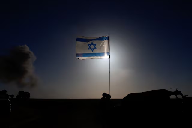 An Israeli flag flies, near the Israel-Gaza border, amid the ongoing conflict between Israel and the Palestinian Islamist group Hamas, in Israel, March 4, 2024. REUTERS/Ammar Awad/File Photo 