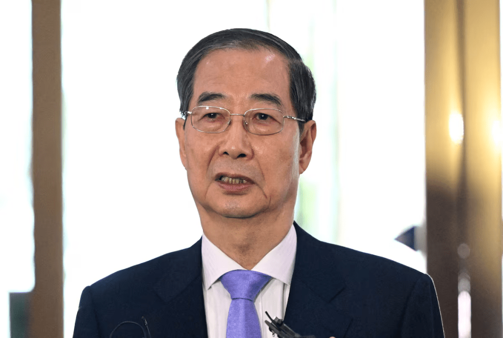 South Korean Prime Minister Han Duck-soo speaks to the media as he arrives at the Government Complex in Seoul on March 24, 2025. JUNG YEON-JE/Pool via REUTERS/File Photo