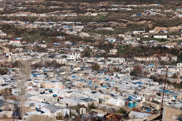 A drone view shows refugee tents in the country side of Idlib, Syria, January 3, 2026. REUTERS/Mahmoud Hassano/File Photo