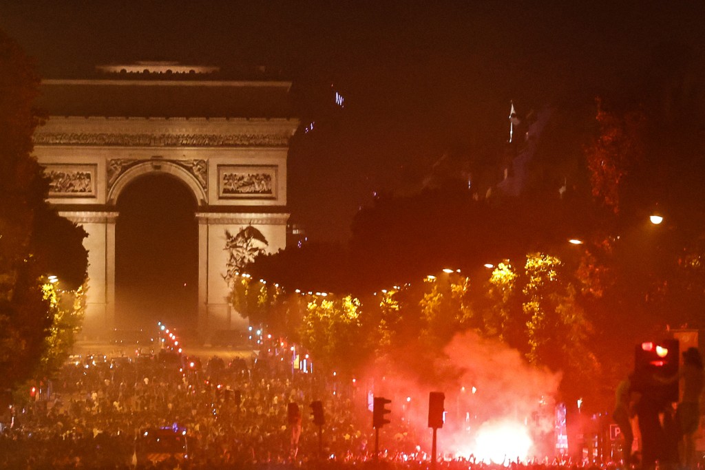 PSG supporters gather on the Champs-Elysees Avenue after the club won the UEFA Champions League final between Paris Saint-Germain (PSG) and Arsenal FC played in Budapest, in Paris on May 30, 2026. (AFP)