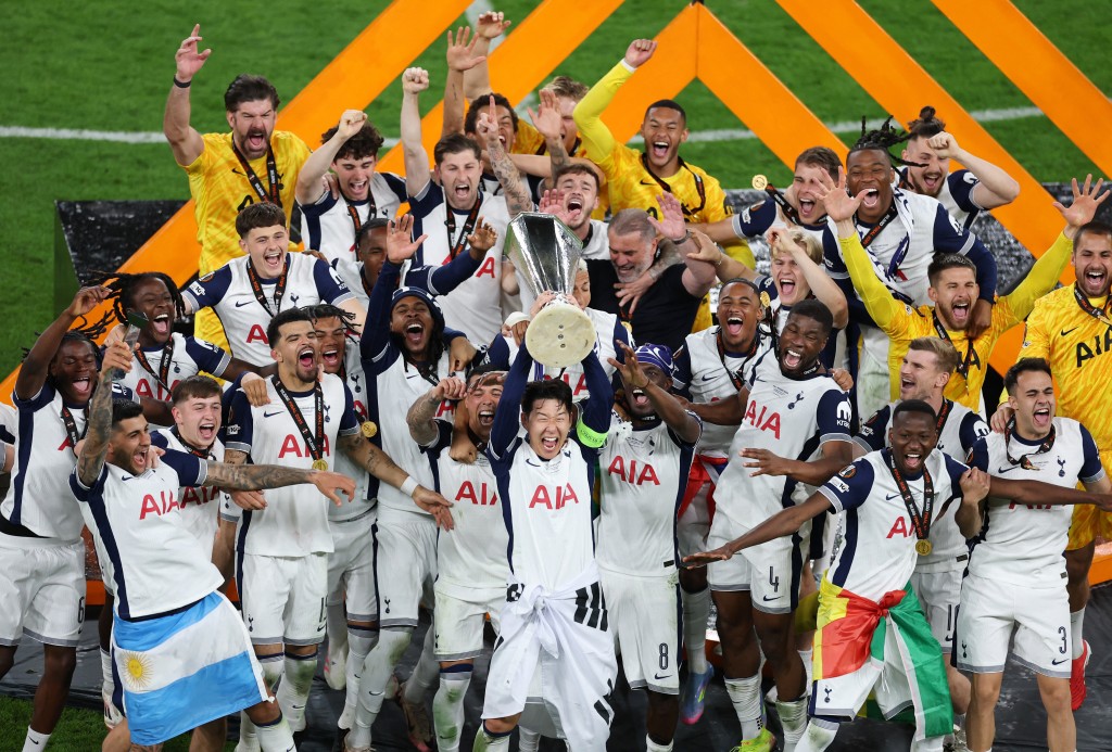 Tottenham Hotspur's Son Heung-min lifts the trophy as he celebrates with his teammates after winning the Europa League. (Reuters)