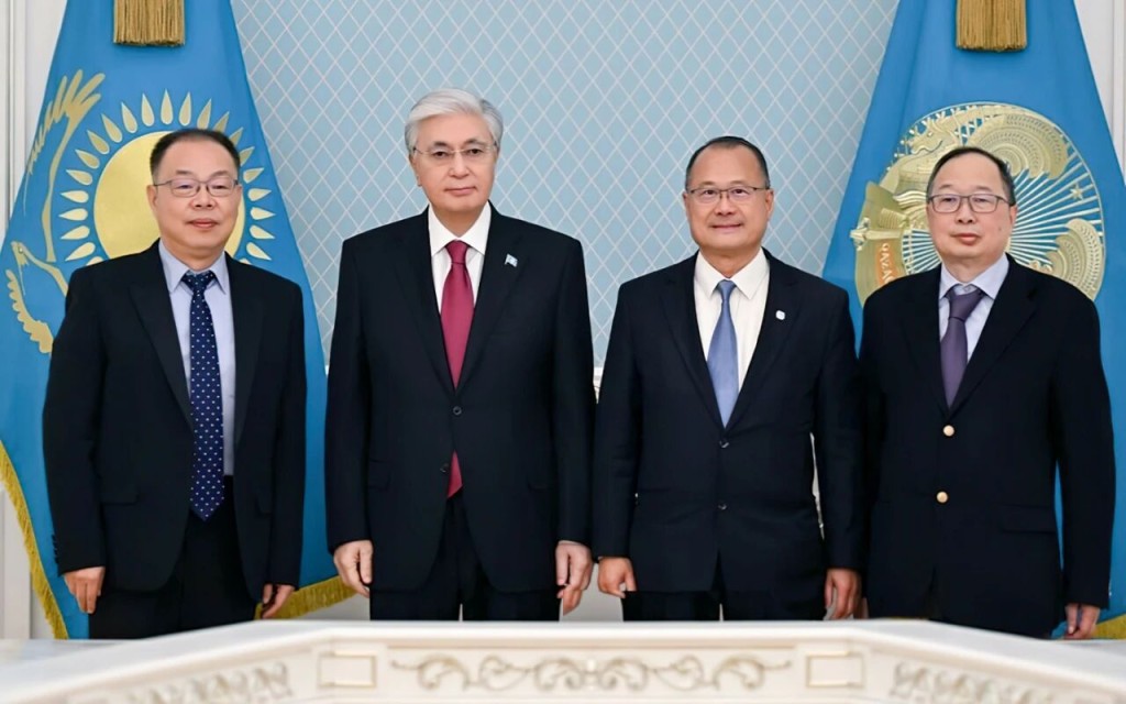 Jonathan Choi, second right, is received by Kassym-Jomart Tokayev, president of Kazakhstan, second left, during his visit to Astana in February. CGCC