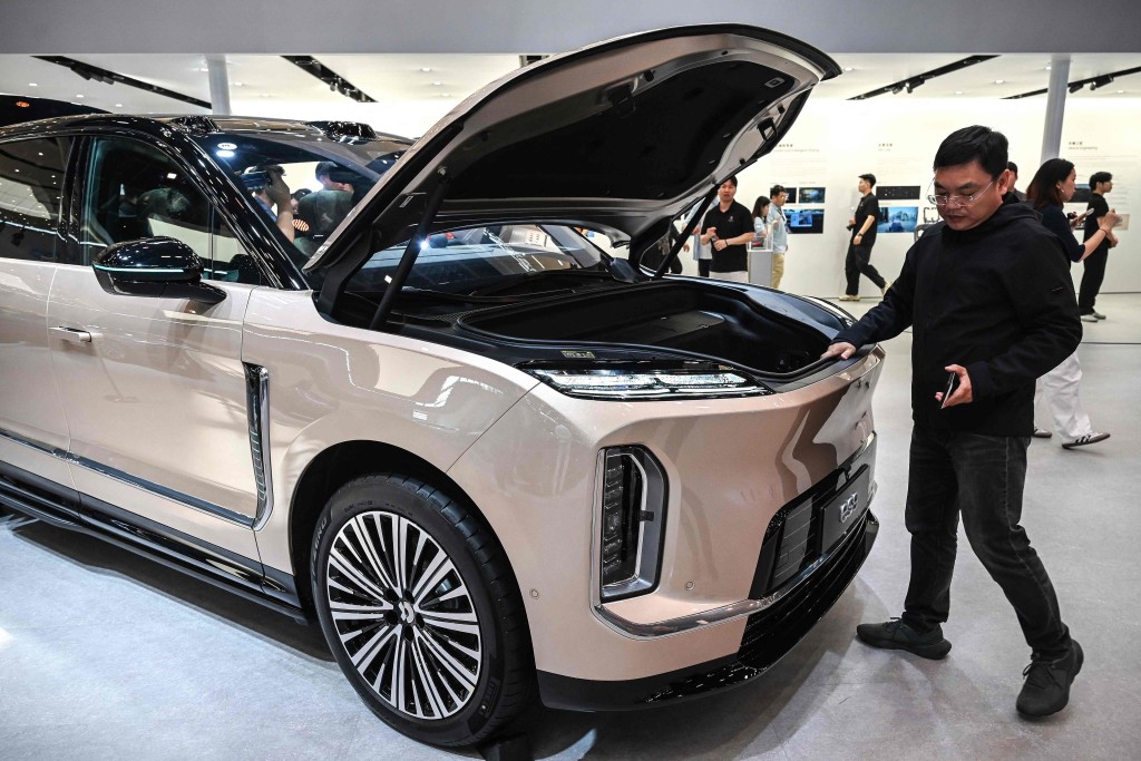 A man looks at a Nio ES9 at the Beijing Auto Show in Beijing on April 25, 2026. AFP