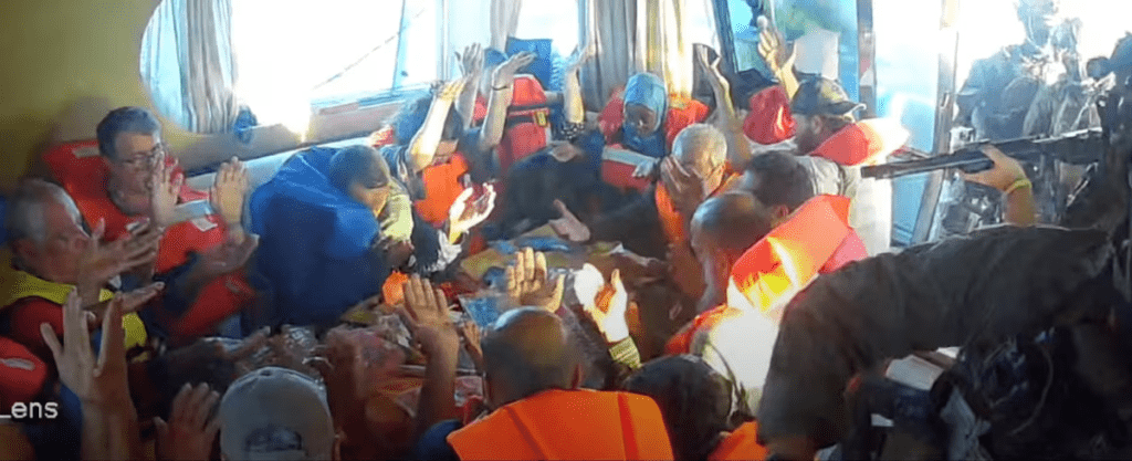 A screengrab from a live stream video shows crew raise their hands after Israeli navy forces boarded the Gaza-bound vessel Florida, part of the Global Sumud Flotilla, which flotilla organisers report has been intercepted, October 2, 2025. Global Sumud Flotilla/Handout via REUTERS