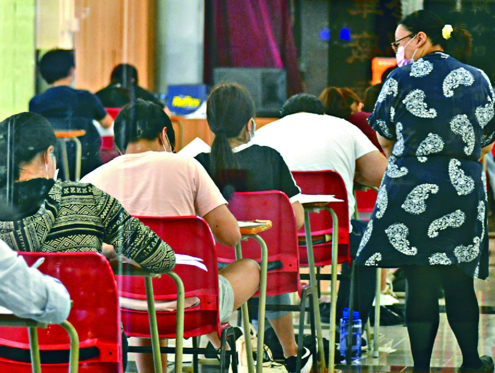 Changes in the liberal studies subject may undermine the credibility of DSE among overseas universities, according to education consultants, including, from left, Sing Wong, Samuel Chan and Javis Wai. Changes in the liberal studies subject may undermine the credibility of DSE among overseas universities, according to education consultants, including, from left, Sing Wong, Samuel Chan and Javis Wai.