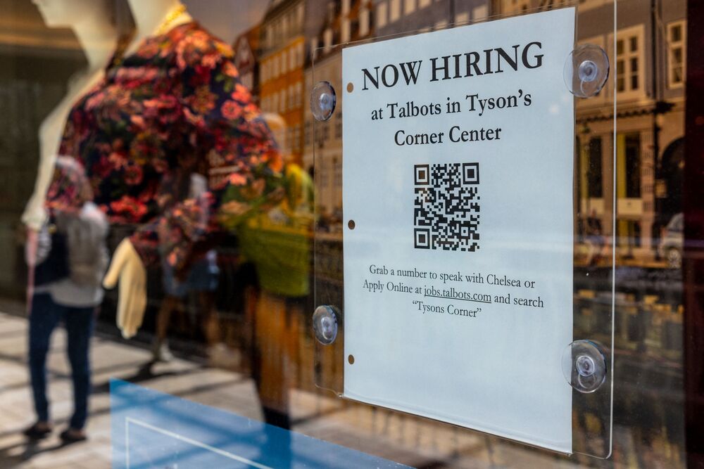 A hiring sign is posted in front of a display at Talbots at the Tysons Corner Center mall on August 22, 2024 in Alexandria, Virginia. AFP